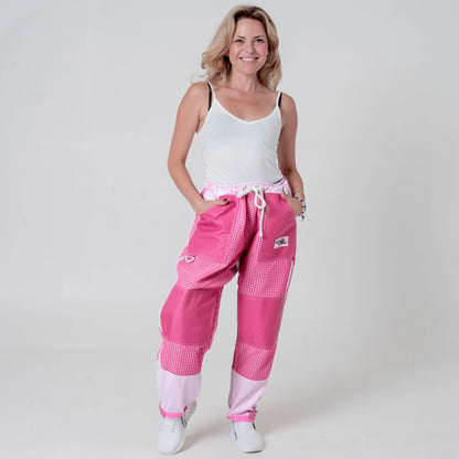 Woman wearing pink beekeeping trousers, front view full body