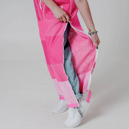 Close up of leg vent zipper opened on the pink beekeeping trousers showing jeans underneath