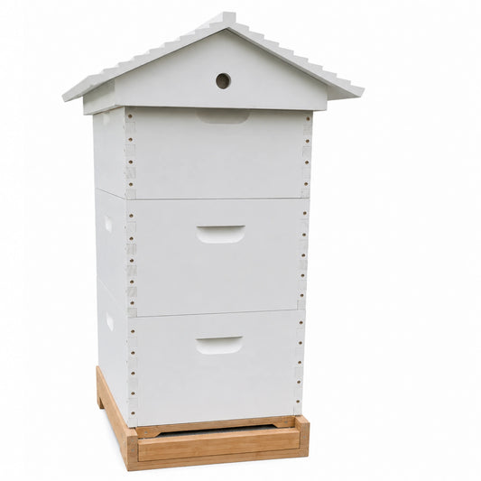 White three-box Langstroth beehive with a peaked gabled roof and ventilated entrance, shown from the front with the pull-out bottom tray extended on a wooden stand